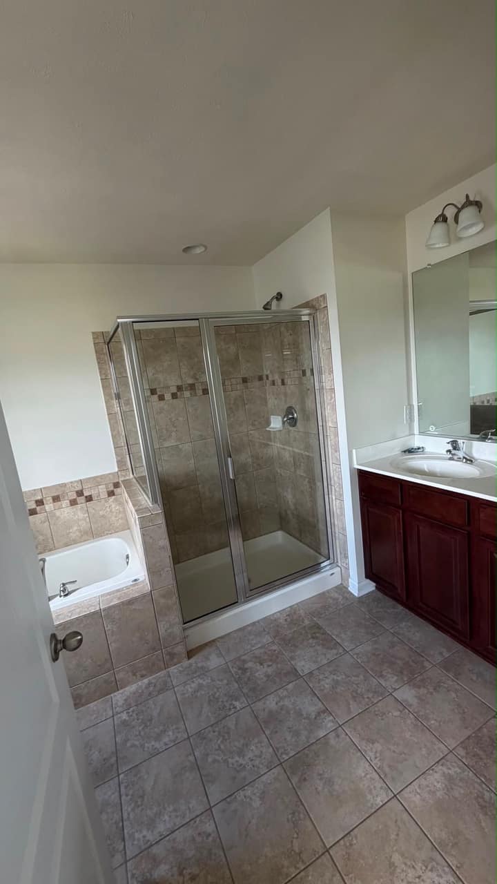 Spotless glass shower cleaned by Mountaineer Cleaning Maids
